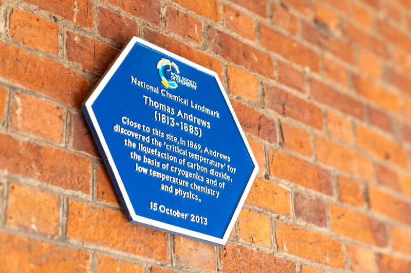 A National Chemical Landmark blue hexagonal plaque from the Royal Society of Chemistry on Queen's University Belfast's Lanyon Building honours Thomas Andrews's contributions to science.